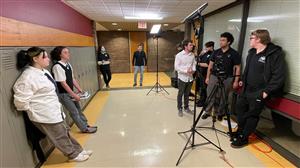 Movie Crew works in the hallway